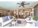 Inviting screened patio with stylish furniture, ceiling fan, and backyard views at 4404 Ne 4Th St, Ocala, FL 34470