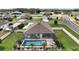 Screened-in pool is the focal point of the back yard of this home in a planned community at 4721 Se 36Th St, Ocala, FL 34480