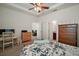 A large bedroom with an entertainment center and carpet flooring at 4721 Se 36Th St, Ocala, FL 34480