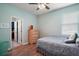 A cozy bedroom with mint walls and a wooden dresser at 4721 Se 36Th St, Ocala, FL 34480