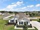 Well-kept home with a manicured lawn, complemented by classic blue shutters at 4721 Se 36Th St, Ocala, FL 34480