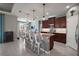 Spacious kitchen with granite countertops, dark cabinets, stainless steel appliances and a large island with seating at 4721 Se 36Th St, Ocala, FL 34480