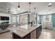 Modern kitchen island offering a sink, granite countertops, and stainless steel dishwasher for added convenience at 4721 Se 36Th St, Ocala, FL 34480