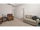 Bright living room with a cozy sofa and reading chair at 4721 Se 36Th St, Ocala, FL 34480