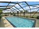 Inviting pool with screen enclosure offers a serene backyard escape at 4721 Se 36Th St, Ocala, FL 34480
