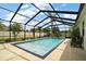 Sparkling swimming pool in a screened-in enclosure offers a refreshing retreat at 4721 Se 36Th St, Ocala, FL 34480