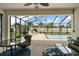 Screened-in patio features ample seating and view of the refreshing pool at 4721 Se 36Th St, Ocala, FL 34480
