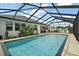 Sparkling pool with expansive screened-in enclosure offers the perfect backyard oasis at 4721 Se 36Th St, Ocala, FL 34480