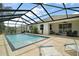 Inviting pool with screen enclosure offers a perfect setting for relaxation and recreation at 4721 Se 36Th St, Ocala, FL 34480
