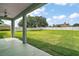 View from the covered patio overlooking the expansive and well-maintained backyard at 4743 Se 34Th St, Ocala, FL 34480