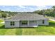 A lovely shot of the home's back exterior and spacious lawn at 4743 Se 34Th St, Ocala, FL 34480