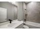 Bathroom featuring single sink vanity with quartz countertops, tile floors, and a shower/tub combo at 4743 Se 34Th St, Ocala, FL 34480
