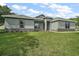 Charming home featuring a well-manicured lawn and stone accents at 4743 Se 34Th St, Ocala, FL 34480
