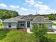 Charming single-story home boasts a well-manicured lawn and a welcoming entrance, creating instant curb appeal at 4743 Se 34Th St, Ocala, FL 34480