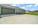 Spacious two-car garage with an extra-long driveway and manicured landscaping at 4743 Se 34Th St, Ocala, FL 34480