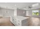 Spacious kitchen island with barstool seating complemented by pendant lighting and LVP flooring at 4743 Se 34Th St, Ocala, FL 34480