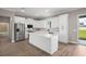 Modern kitchen featuring an island, stainless steel appliances, and white cabinetry at 4743 Se 34Th St, Ocala, FL 34480