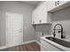 Laundry room with plenty of cabinet space, countertop, and a utility sink at 4743 Se 34Th St, Ocala, FL 34480