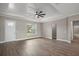 Spacious living room with luxury vinyl plank flooring, large window, and access to front door at 4743 Se 34Th St, Ocala, FL 34480