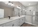 Elegant bathroom featuring double sink vanity with quartz countertops and a large walk-in shower at 4743 Se 34Th St, Ocala, FL 34480