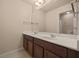Bathroom featuring a double sink vanity, and a mirror that stretches across the counter at 5128 Grassy Knoll Dr, Tavares, FL 32778