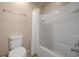 Clean white bathroom featuring a bathtub and shower combination with white tile surround at 5128 Grassy Knoll Dr, Tavares, FL 32778