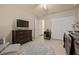 Cozy Bedroom with crib, dresser, ceiling fan, and ABC rug at 5128 Grassy Knoll Dr, Tavares, FL 32778