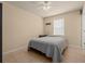 Bedroom featuring neutral walls, tile flooring, and a standard sized window at 5128 Grassy Knoll Dr, Tavares, FL 32778