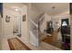 Inviting entryway with a staircase, neutral color palette, and tile flooring, leads into the living area at 5128 Grassy Knoll Dr, Tavares, FL 32778