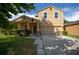 Charming two-story home with a well-manicured lawn and attached two-car garage at 5128 Grassy Knoll Dr, Tavares, FL 32778