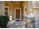 Inviting porch with brick pillars and a cozy bench, enhancing the home's curb appeal at 5128 Grassy Knoll Dr, Tavares, FL 32778