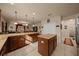 Expansive kitchen featuring a large island and breakfast bar with view to the Gathering room at 5128 Grassy Knoll Dr, Tavares, FL 32778