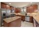 Well-equipped kitchen with stainless steel appliances and granite countertops, great for entertaining at 5128 Grassy Knoll Dr, Tavares, FL 32778