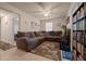 Comfortable living room with tile floors, ceiling fan, and view to the hallway at 5128 Grassy Knoll Dr, Tavares, FL 32778