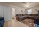 Inviting living room featuring a comfortable sectional and stylish decor at 5128 Grassy Knoll Dr, Tavares, FL 32778