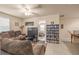Cozy living room with comfortable seating, ceiling fan, and an open view to the next room at 5128 Grassy Knoll Dr, Tavares, FL 32778