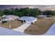 Beautiful aerial showcases the home's curb appeal, complemented by a long driveway and manicured landscaping at 6150 Sw 103Rd Loop, Ocala, FL 34476