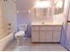 Bathroom features a tub, toilet, and white vanity with decorative mirror at 6150 Sw 103Rd Loop, Ocala, FL 34476