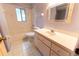 Bathroom features a tub and shower combination with a decorative mirror at 6150 Sw 103Rd Loop, Ocala, FL 34476