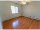 Bedroom with natural light, ceiling fan, and wood floor at 6150 Sw 103Rd Loop, Ocala, FL 34476