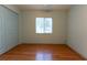 Bedroom with a ceiling fan, wood floor and a closet with blue doors at 6150 Sw 103Rd Loop, Ocala, FL 34476