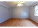 A spacious bedroom is well lit by a ceiling fan and window, with closet at 6150 Sw 103Rd Loop, Ocala, FL 34476