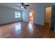 This spacious bedroom features wood flooring and a ceiling fan at 6150 Sw 103Rd Loop, Ocala, FL 34476