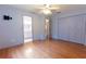 Large bedroom with hard surface floors, ceiling fan, closet and attached bathroom at 6150 Sw 103Rd Loop, Ocala, FL 34476