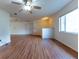 Open living room showcasing hard surface floors, a ceiling fan, and a neutral color palette, offering a versatile space at 6150 Sw 103Rd Loop, Ocala, FL 34476