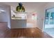 Open concept living and kitchen area with bright lighting and modern appliances at 6150 Sw 103Rd Loop, Ocala, FL 34476
