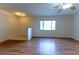 Comfortable living room filled with hard surface floors, natural light, and a ceiling fan for year-round comfort at 6150 Sw 103Rd Loop, Ocala, FL 34476
