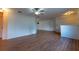 Expansive living room with hard surface floors, a ceiling fan, and a seamless flow to other living spaces at 6150 Sw 103Rd Loop, Ocala, FL 34476