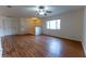 Inviting living room featuring hard surface floors, a ceiling fan, and easy access to other rooms in the home at 6150 Sw 103Rd Loop, Ocala, FL 34476