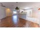 Spacious living area with hardwood floors, opening to the kitchen and front entryway at 6150 Sw 103Rd Loop, Ocala, FL 34476